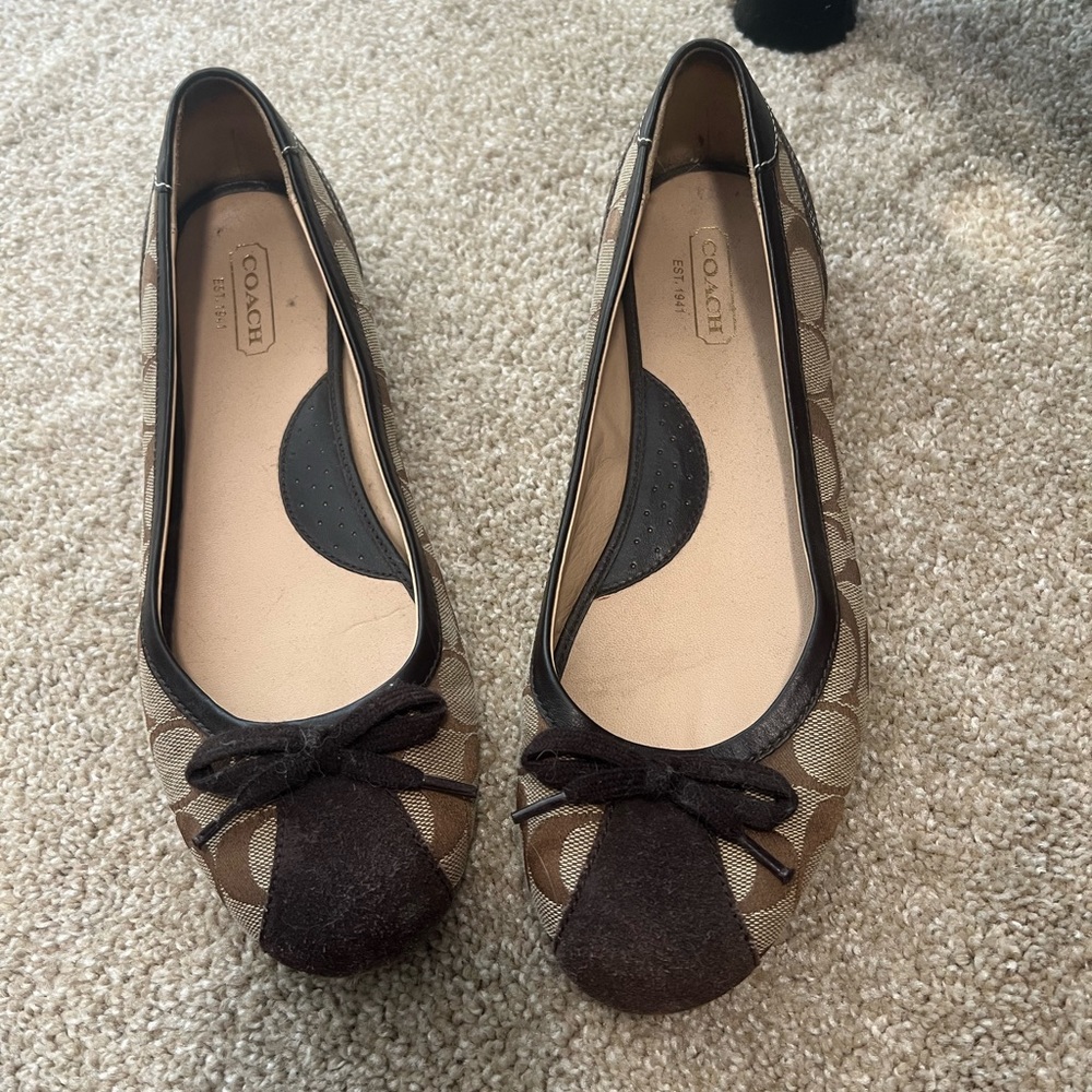 Excellent used condition Coach flats. Size 10
